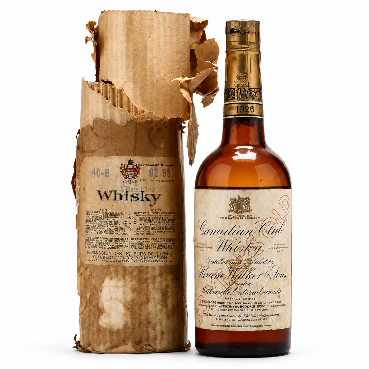 Historic Canadian Club whisky bottle beside its original package