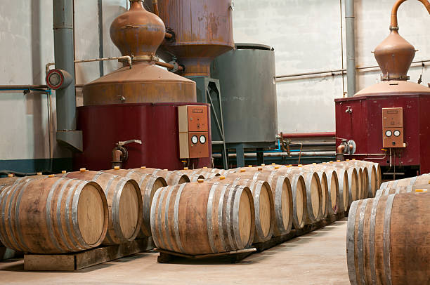 Cognac production stills and oak barrels