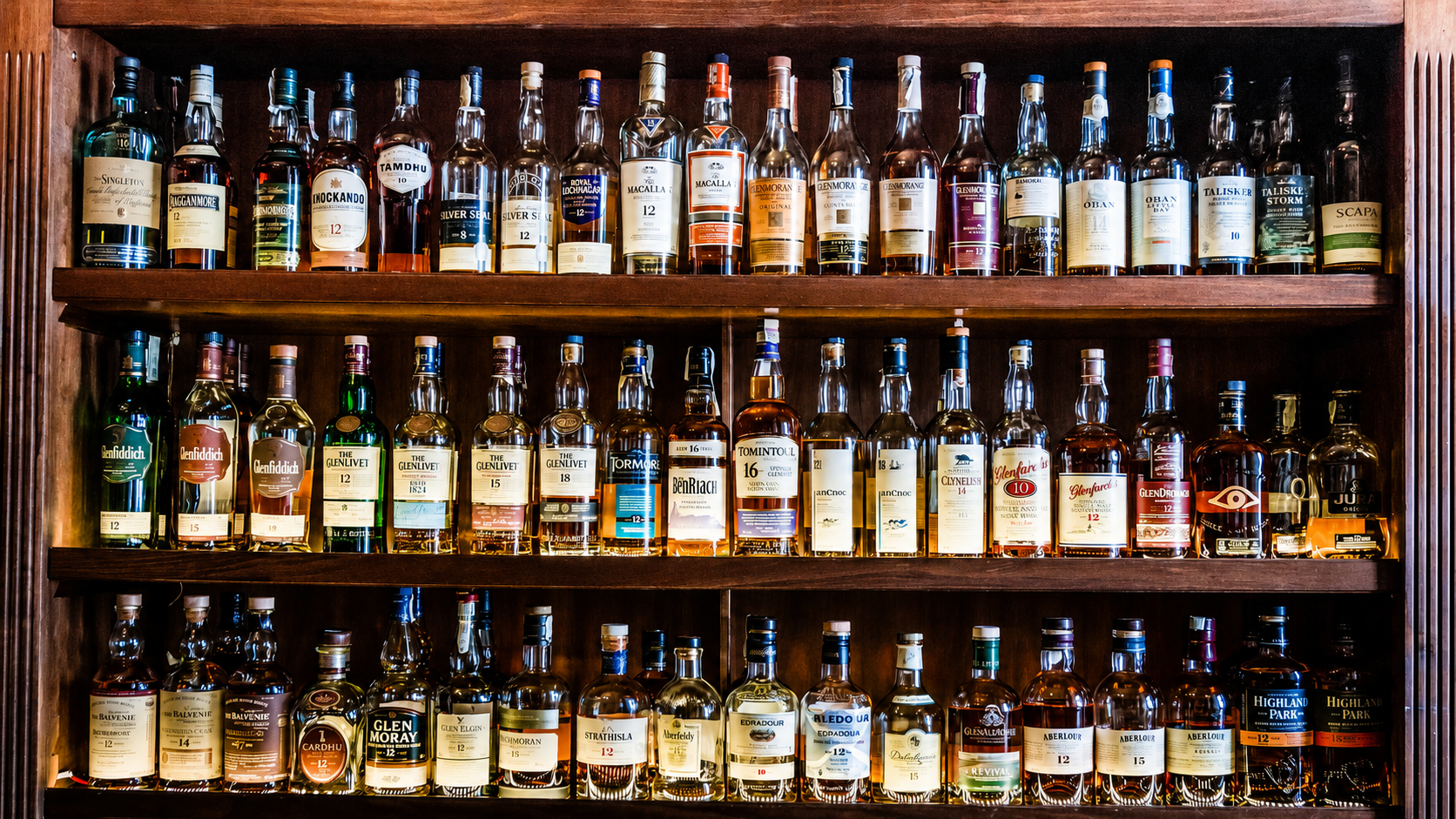 Selection of Scotch whisky bottles on shelves