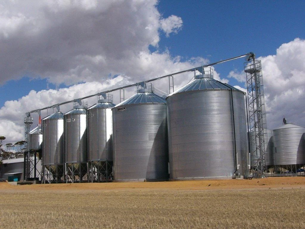 Large metal grain storage silos used for bulk cereal storage and handling